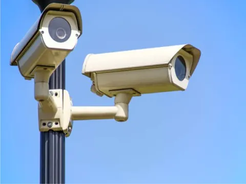 Pole-mounted CCTV cameras covering the perimeter of a property